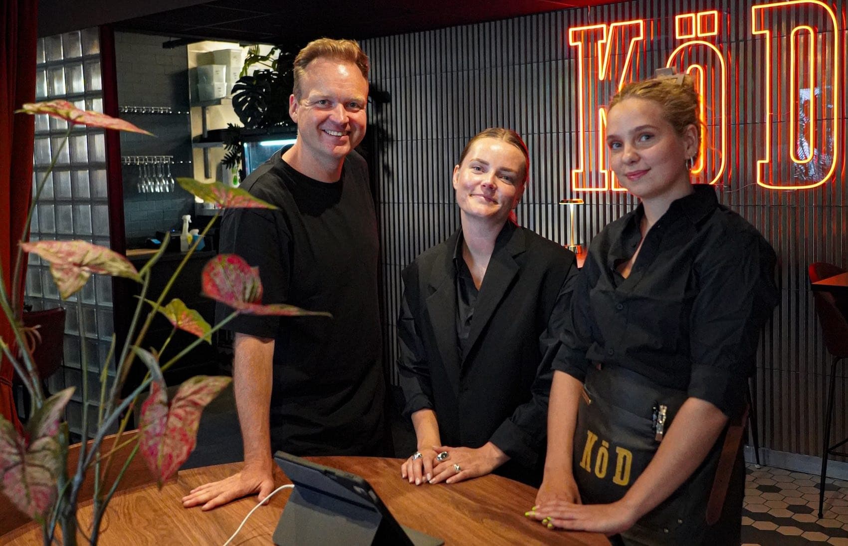 Restaurant staff warmly greeting guests